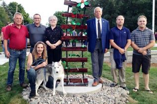L to R: Mark Segsworth, Public Works Manager; Dave Holliday, PW Area Supervisor; Brenda Crawford, Chair, Harrowsmith Beautification Committee; Mayor Ron Vandewal; Murray Aitken, Owner, Morven Construction (and Harrowsmith resident); Jeff Hutchins, Project Manager, Morven Construction. Foreground: Godfrey artist Rick Law.